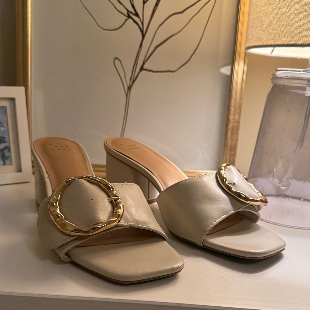 Elegant Cream Heeled Sandals with Gold Accent